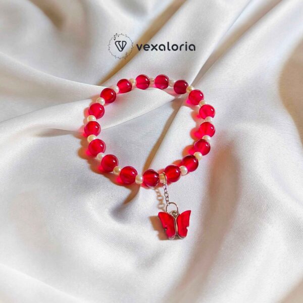 🦋 Elegant Maroon Pearl Butterfly Bracelet – Stretch Fit with Charm Bead